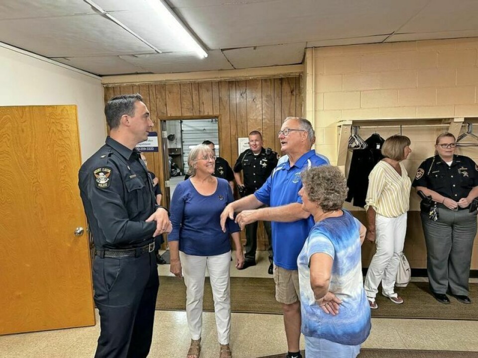 New Mt. Eaton Police Chief Alan Sands chats with visitors during his recent swearing-in ceremony in the Village Hall on Thursday, July 11. Mt. Eaton finds its police chief in Sands