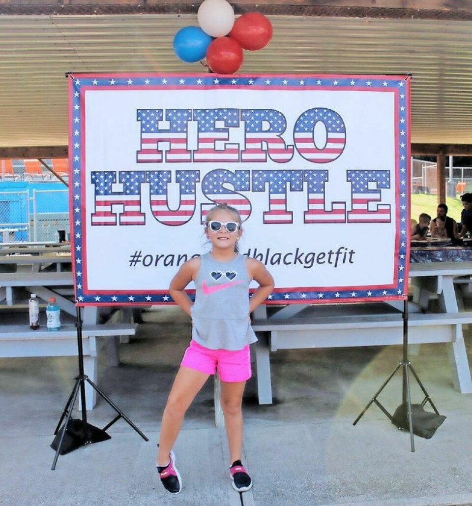 Claire Bates, 6, of Newcomerstown shows her readiness as a first-time participant in the Hero Hustle 5k. She ran with her grandmother Sondra Bates. Hero Hustle 5k Water Run a hit