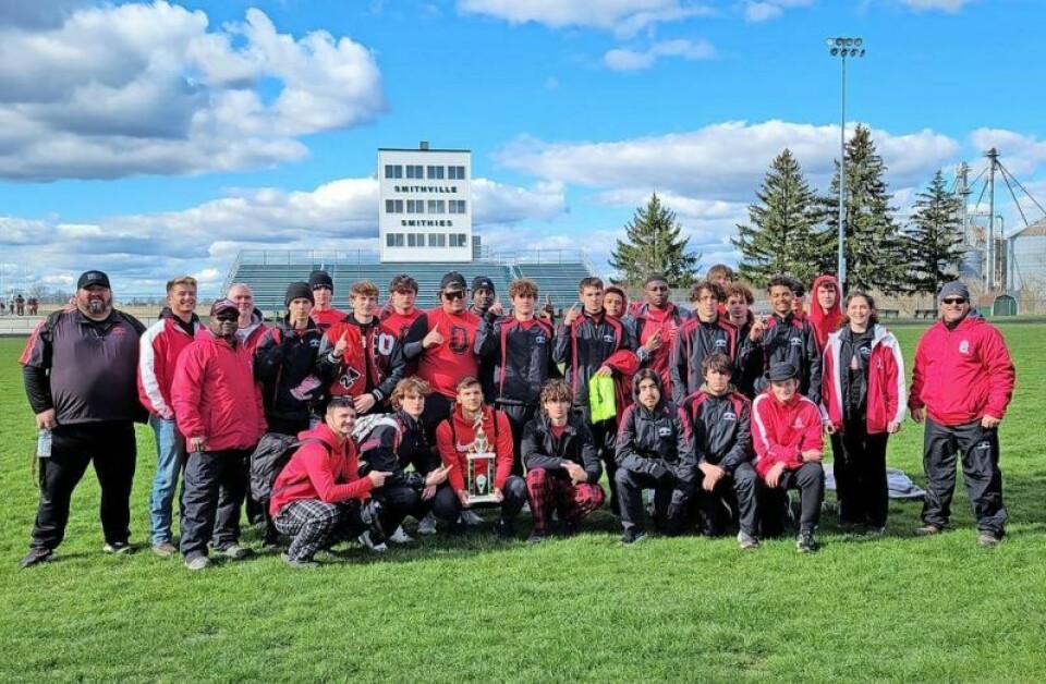 Members of the Orrville boys track team pose with the championship trophy after winning the 68th McCay Relays on April 6. Balanced effort gives Orrville boys title at McCay Relays