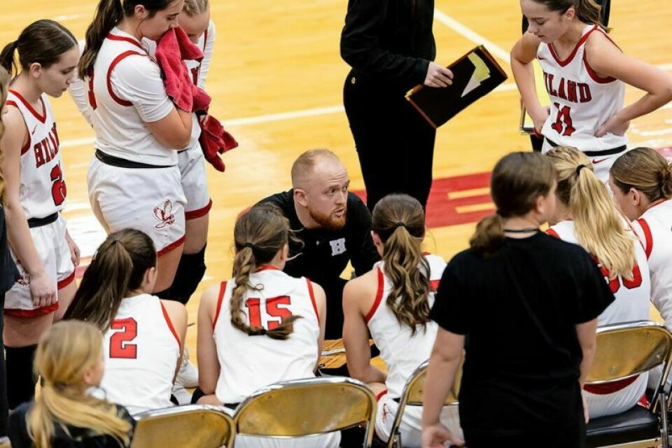 Hiland coach Brady Schlabach, center, gives instructions to his players during a timeout in their game against Reynoldsburg during the three-day Classic in the Country. Hiland girls hoops to use CitC as ‘learning weekend’