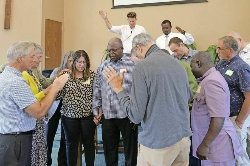 A commissioning service was held Oct. 6 at Orrville’s Crown Hill Mennonite Church for Rollin Mukanza, middle, as Open Arms’ community development worker to lead Open Arms Akron, a new pilot program to serve immigrants in Akron with a specific focus on refugees from Congo. Open Arms Hispanic Ministry operates out of Orrville and serves the Latino community in Wayne County and surrounding counties. Open Arms Hispanic Ministry expands into Akron