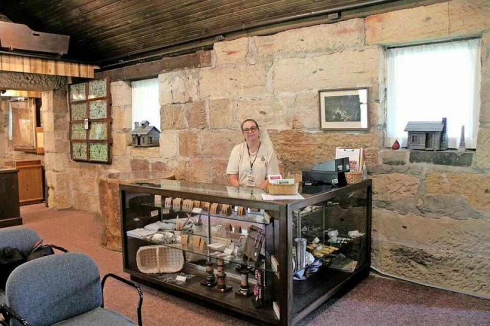 Trudy Lewis, a volunteer with the Gnadenhutten Historical Society, at the newly rearranged front room of the museum. The museum is being reorganized to better reflect the history. Gnadenhutten Pioneer Days to feature reenactors, new museum changes
