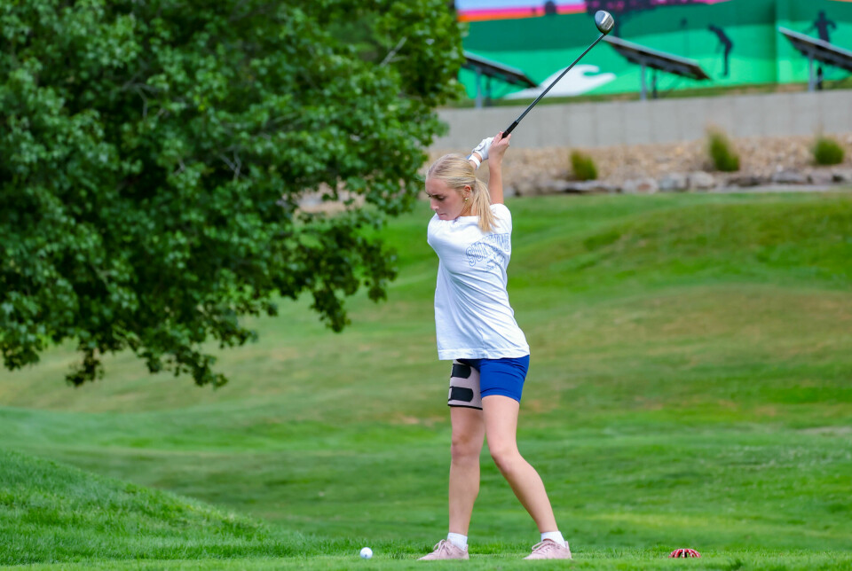 Hiland's Lydia Johnson takes a tee shot.