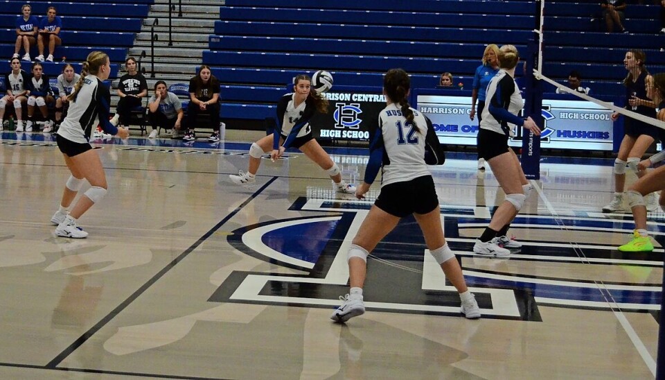 Husky player Lillian Thomas #14 as she is about to return a feed from setter Leah Grady #4.