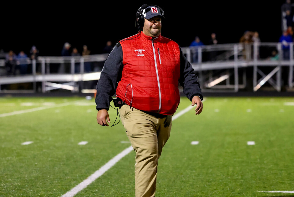 Norwayne coach Adam Indorf walks back towards his sidelines during this battle with Hillsdale.
