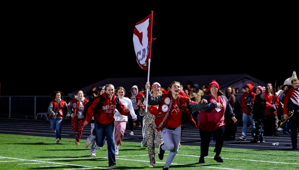 Norwayne students storm the field after their teams 24-17 win led by standout Allie DeMassimo.