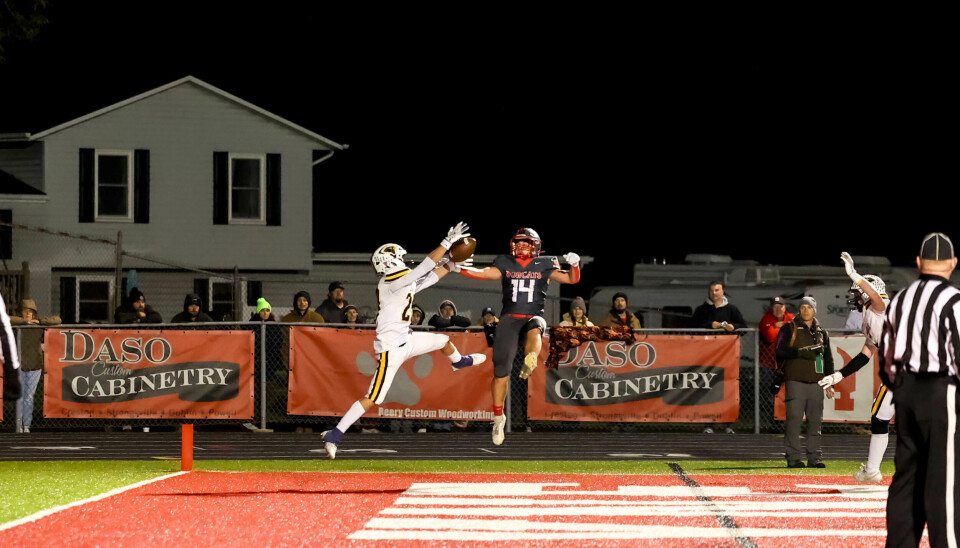 Norwayne's Carter Miller tries to break up this two-point conversion by Hillsdale's Kyle Turk, who hauled in this pass.