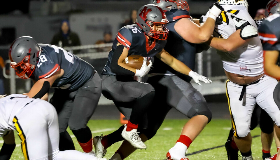 Carson Arnold peels off a few of his team-high 90 yards rushing for Norwayne.
