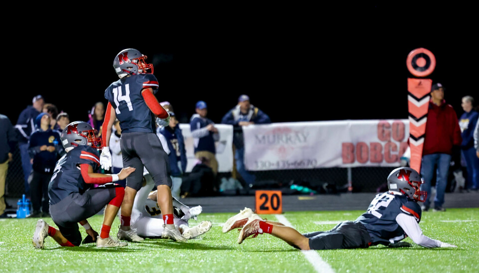 Norwayne's Carter Miller (14) and few others watch his 32 yard field goal split the uprights with 6:04 left in the game to seal the victory.