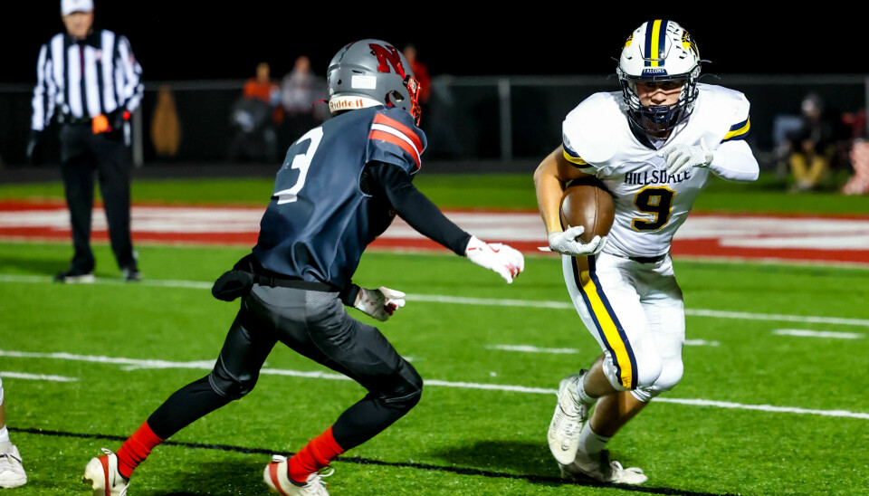 Hillsdale's Deacon Boreman looks for space to move with Norwayne's Carson Mills closing in for the tackle here in the second half.